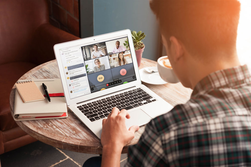 MiTeam-man-laptop-coffee-check-shirt-4-way-chat
